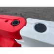 Top view of red and white Defender50 barriers showing the filling access points with removable rubber caps for water ballast.