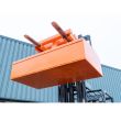 Industrial forklift skip compactor lifting attachment designed to reduce waste volume in large skips for efficient disposal operations.