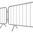 Close-up view of two galvanised barriers interlocked, focusing on the connecting mechanism and angled feet.