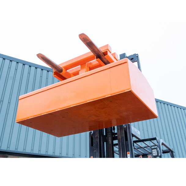 Industrial forklift skip compactor lifting attachment designed to reduce waste volume in large skips for efficient disposal operations.