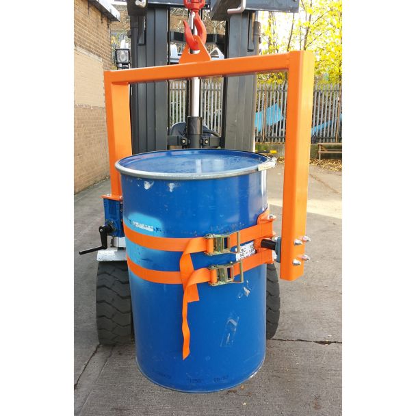 Forklift attachment with crane drum tilter rotating steel drum securely, ensuring efficient handling and safe material transfer.